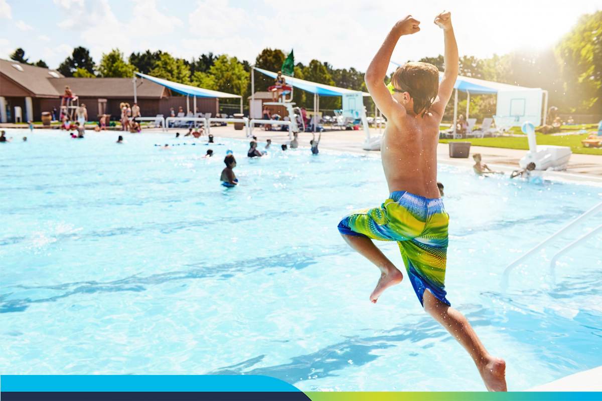 Child jumping into pool