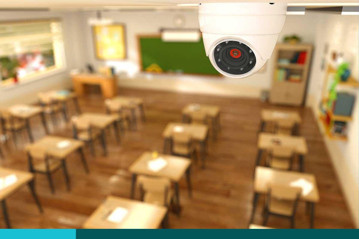 Looking down on a classroom of desks from a ceiling camera